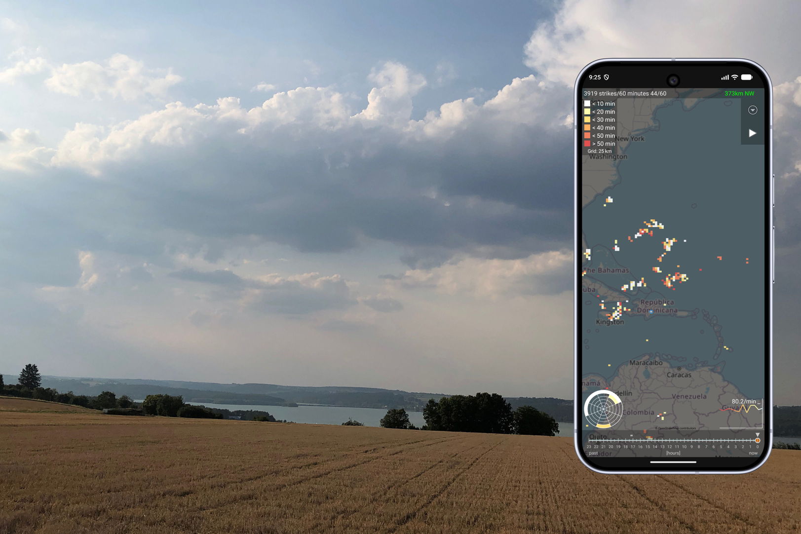A harvested golden field under towering summer clouds that may still develop into a thunderstorm. On the right a screenshot of the current version of the app